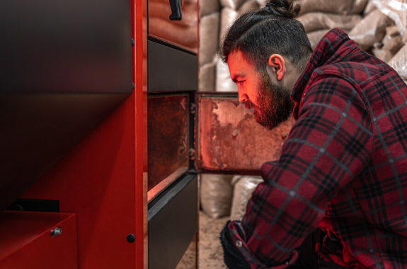 Image of a man looking into his furnace.